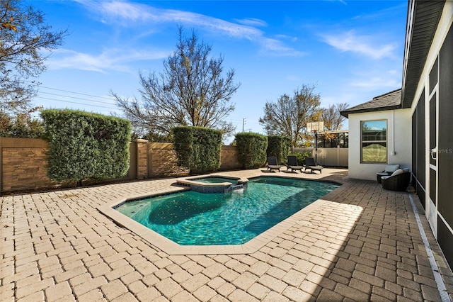 view of pool featuring an in ground hot tub and a patio