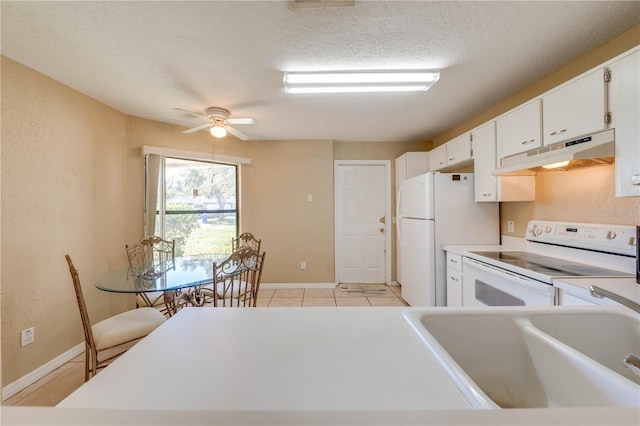 kitchen with white appliances, sink, ceiling fan, a textured ceiling, and white cabinetry