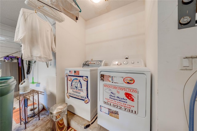 washroom featuring a textured ceiling and separate washer and dryer