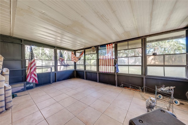 unfurnished sunroom with wood ceiling and a healthy amount of sunlight