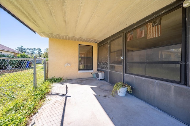 view of patio / terrace featuring a wall unit AC