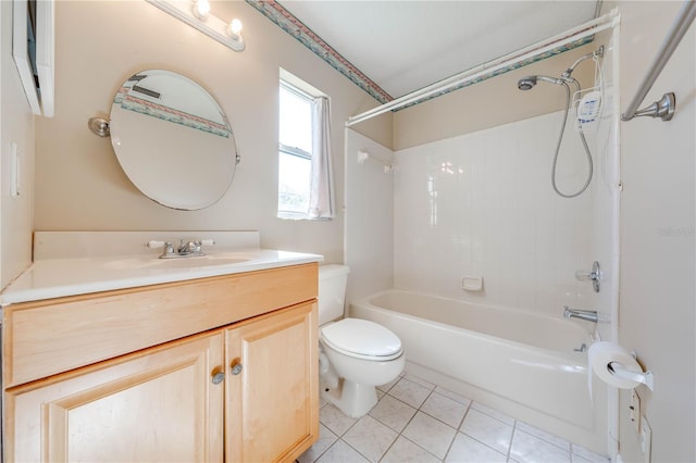 full bathroom featuring toilet, vanity, tile patterned floors, and tiled shower / bath combo