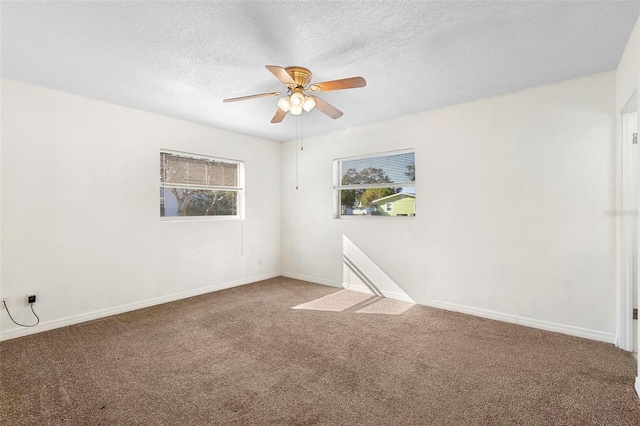 unfurnished room featuring a textured ceiling, carpet floors, and ceiling fan