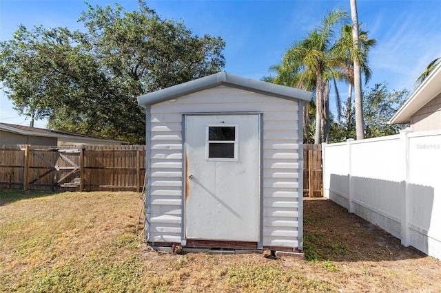 view of outbuilding featuring a lawn