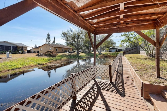 dock area with a water view