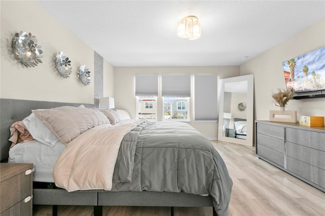 bedroom with light hardwood / wood-style floors