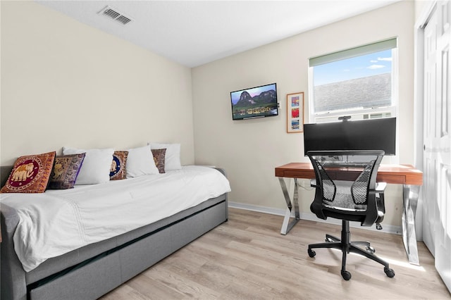 bedroom with light hardwood / wood-style floors