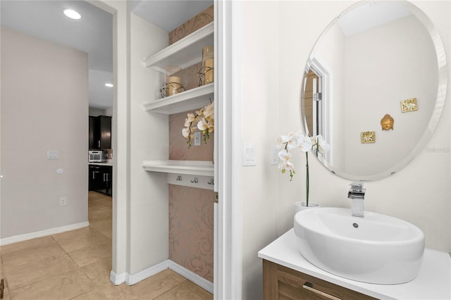 bathroom featuring tile patterned floors and vanity