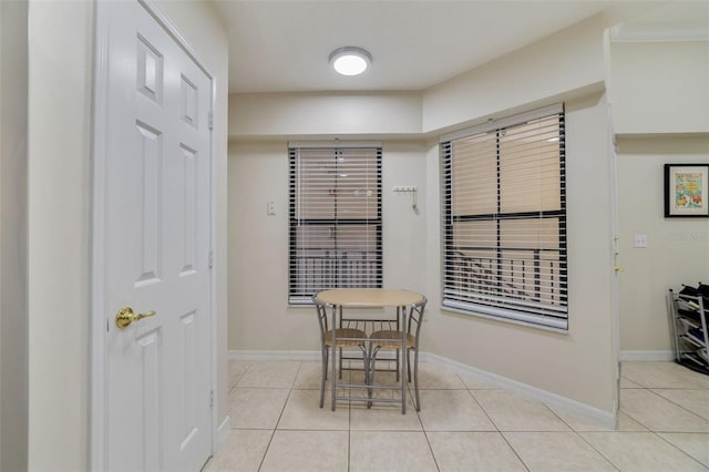 dining area featuring light tile patterned flooring