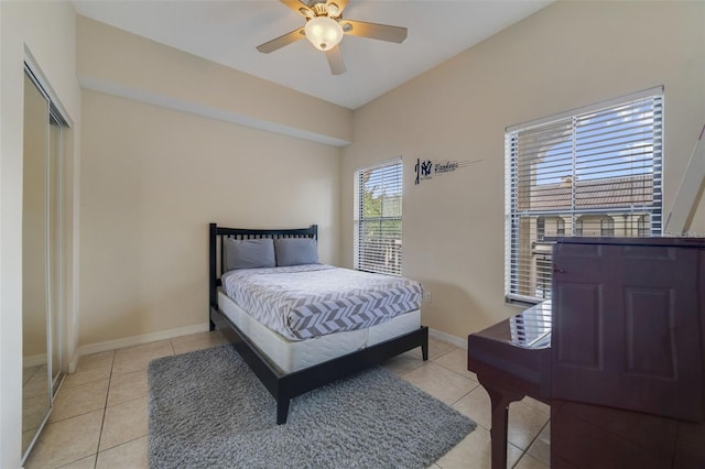 701 Westpark Way Unit 202, Celebration, FL 34747 - bedroom with light tile patterned flooring, ceiling fan, and a closet