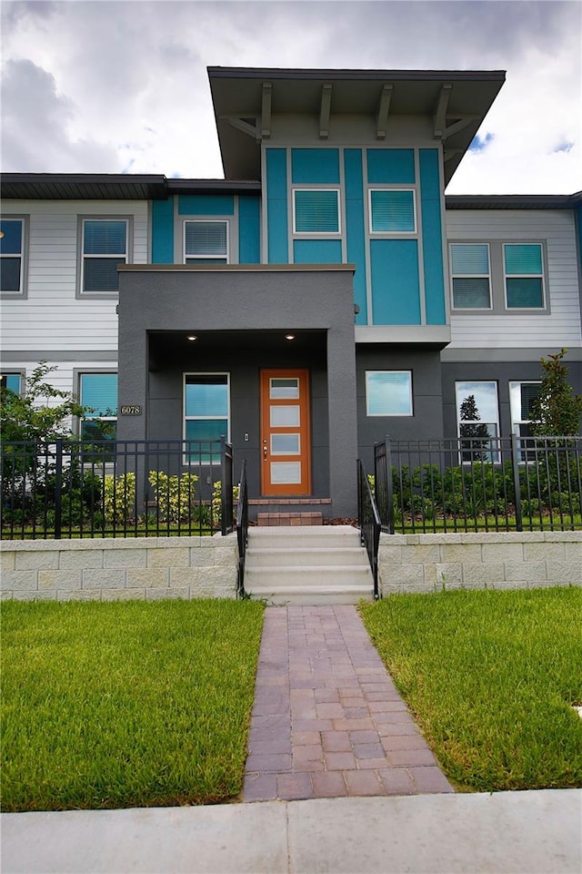 view of front of property with a front lawn