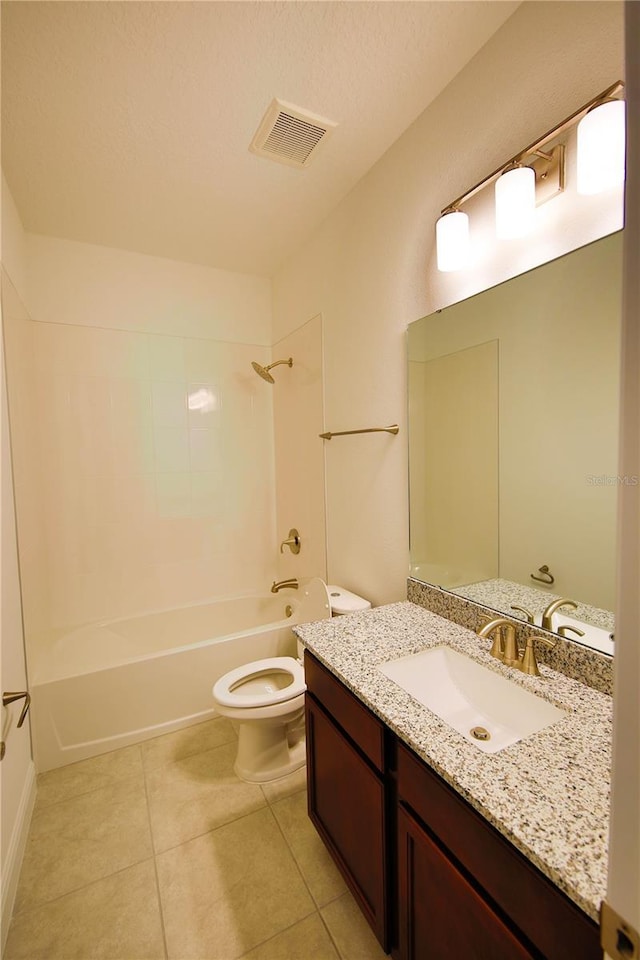 full bathroom featuring toilet, a textured ceiling, shower / bathtub combination, vanity, and tile patterned flooring