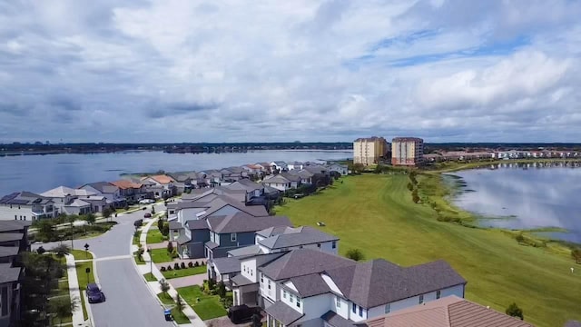 drone / aerial view with a water view