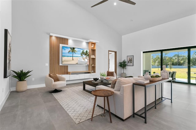 living room featuring high vaulted ceiling and ceiling fan