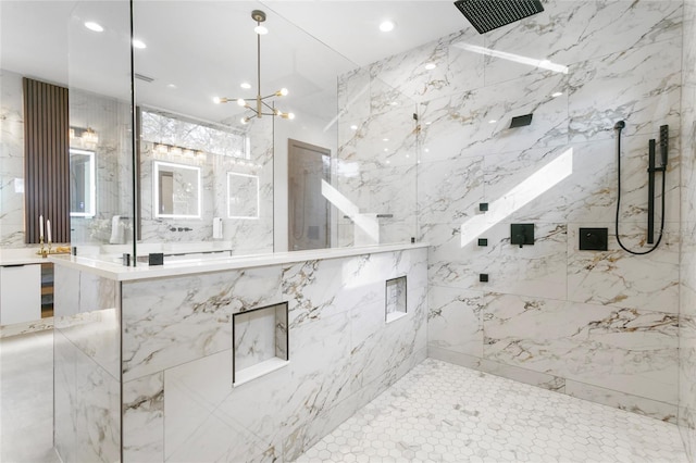 bathroom with an inviting chandelier and tiled shower