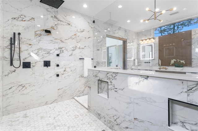 bathroom featuring a chandelier and tiled shower