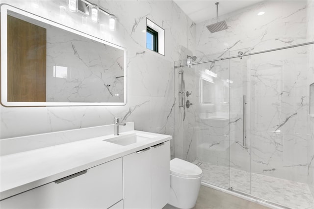 bathroom with tile walls, an enclosed shower, vanity, and toilet