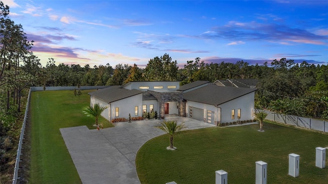 view of front of house with a lawn and a garage