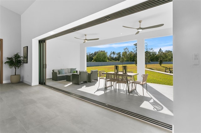 view of patio with ceiling fan and an outdoor hangout area