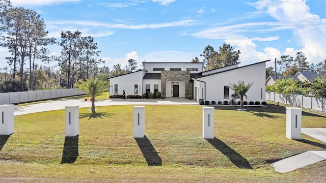 contemporary house featuring a front lawn