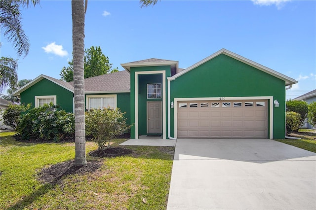 single story home featuring a front yard and a garage