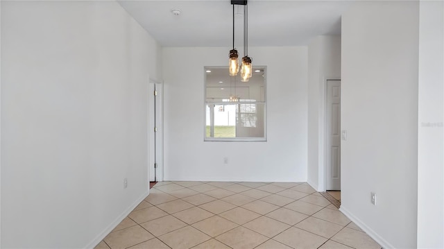 unfurnished dining area featuring light tile patterned floors