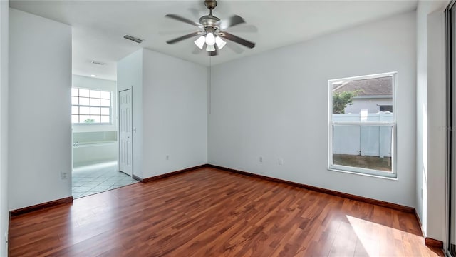 unfurnished room featuring ceiling fan and wood-type flooring