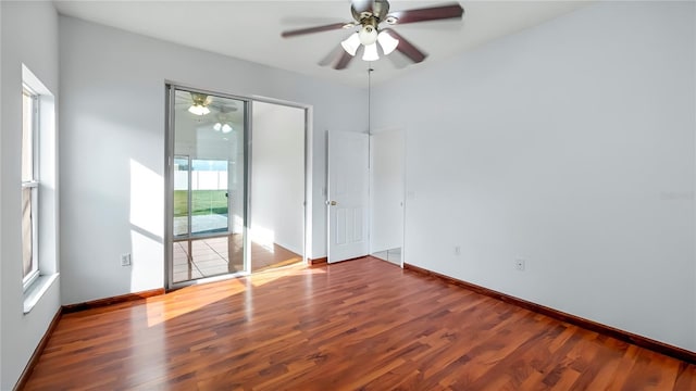 empty room featuring hardwood / wood-style floors and ceiling fan