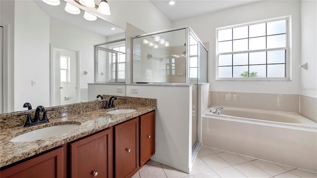 bathroom with vanity, tile patterned floors, and shower with separate bathtub