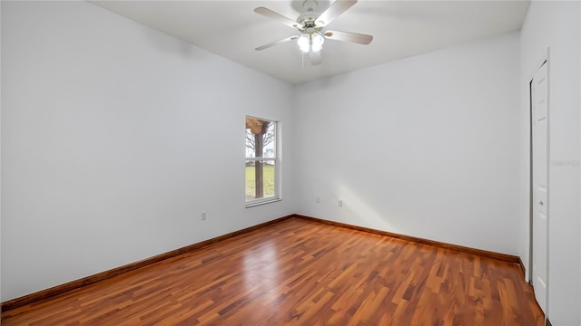 unfurnished room with hardwood / wood-style flooring and ceiling fan