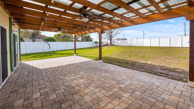 view of patio / terrace with ceiling fan and a pergola