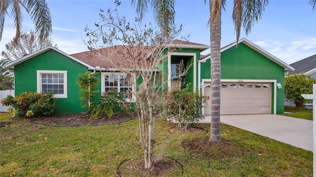 view of front facade featuring a garage and a front lawn