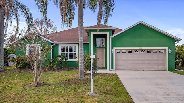 single story home with a garage and a front lawn