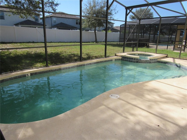 view of pool with a lawn, glass enclosure, and an in ground hot tub