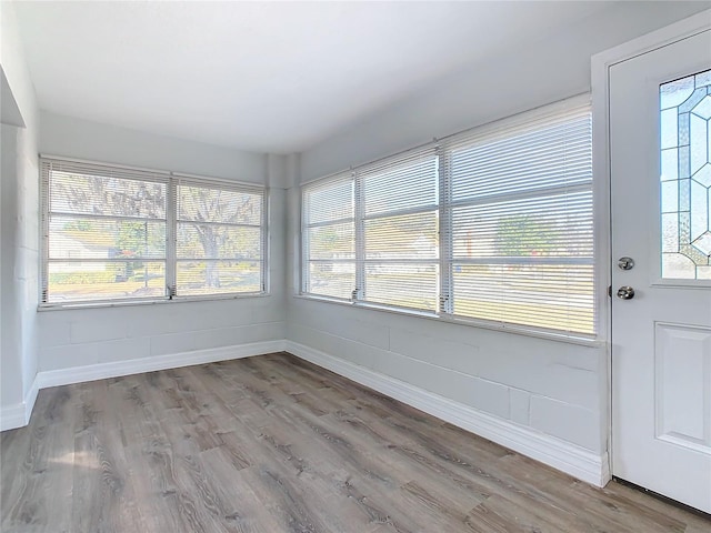 unfurnished sunroom with plenty of natural light