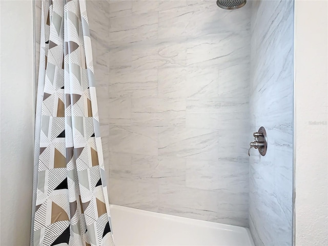 bathroom with a shower with shower curtain