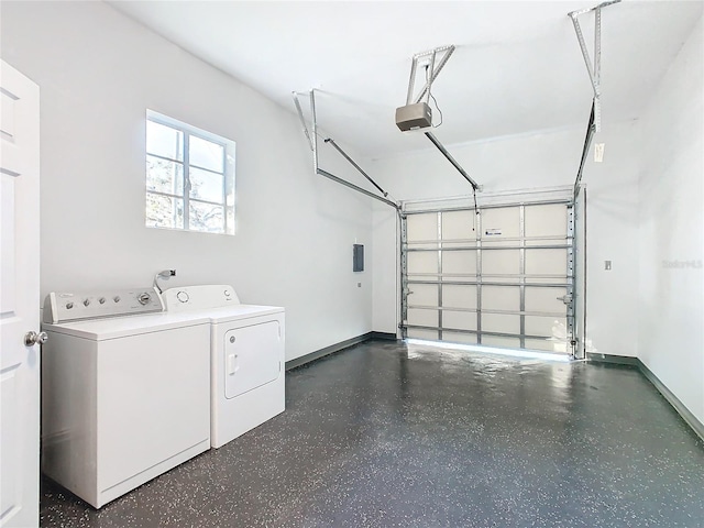 garage featuring a garage door opener and washer and dryer