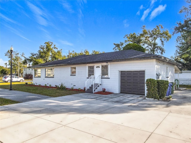 single story home featuring a garage