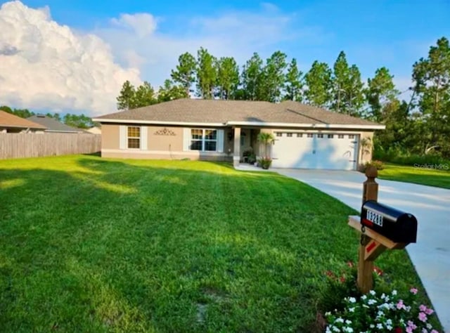 ranch-style house featuring a front yard and a garage