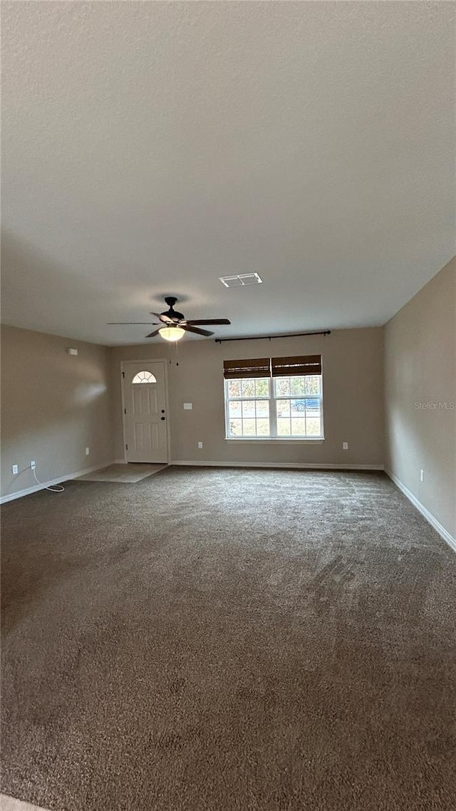 carpeted empty room with ceiling fan