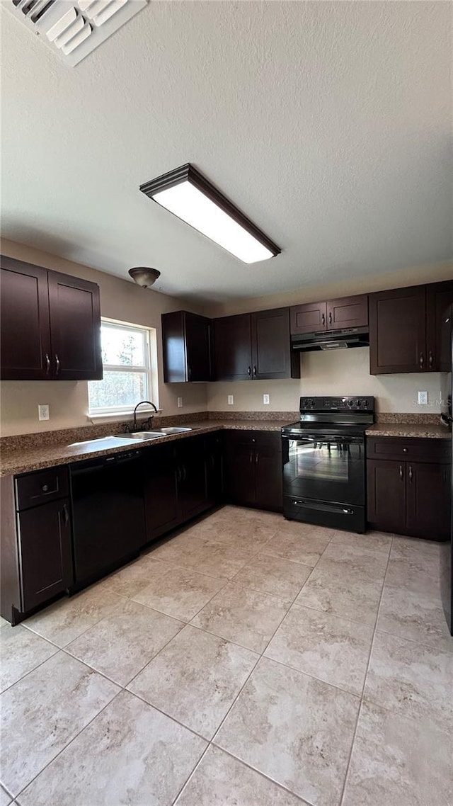 kitchen with sink, black electric range, a textured ceiling, dark brown cabinets, and light tile patterned floors