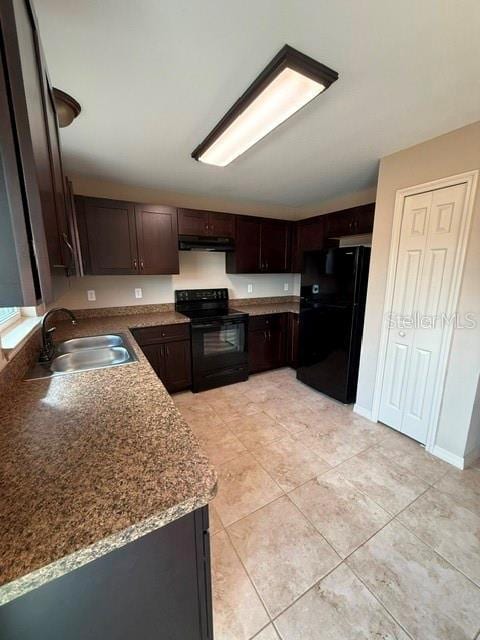 kitchen with light tile patterned floors, sink, dark brown cabinetry, and black appliances