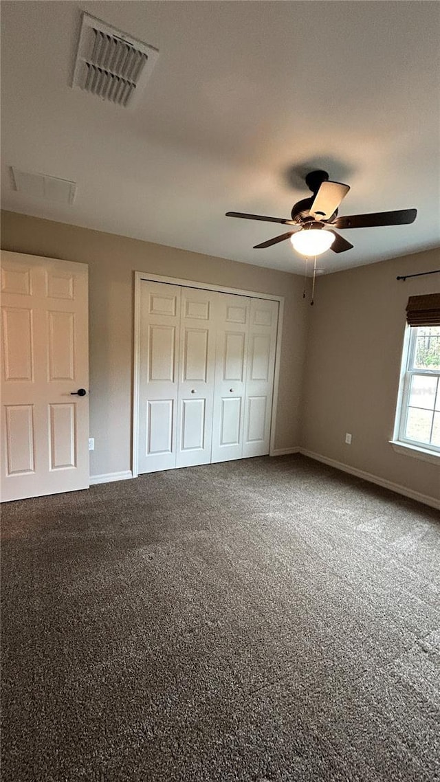 unfurnished bedroom featuring carpet and ceiling fan