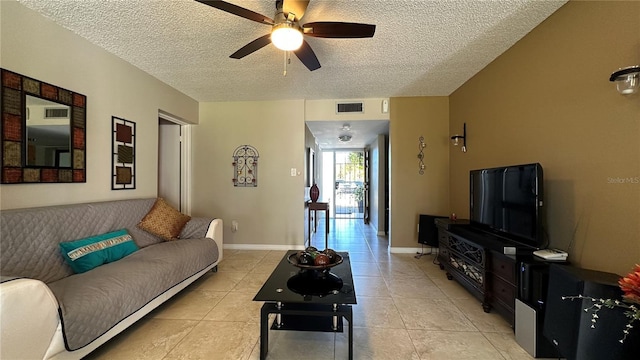 tiled living room featuring a textured ceiling and ceiling fan