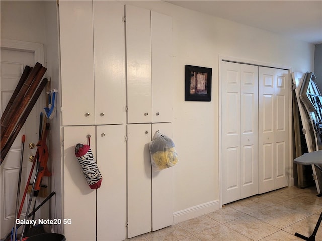 interior space with light tile patterned floors