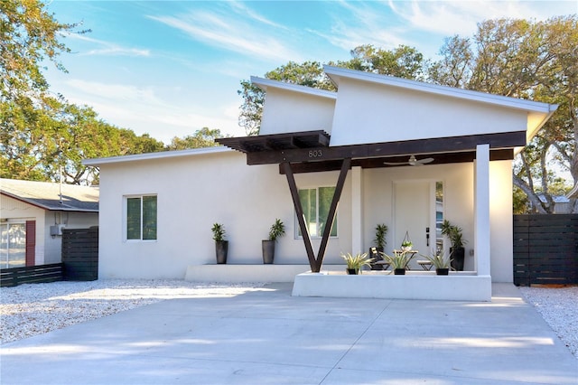 view of front facade featuring ceiling fan and a patio area