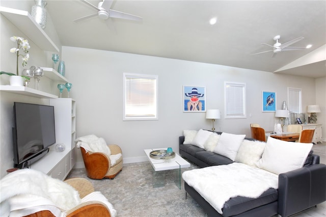 living room featuring ceiling fan, light colored carpet, and lofted ceiling