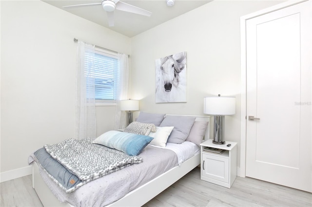 bedroom with ceiling fan and light wood-type flooring