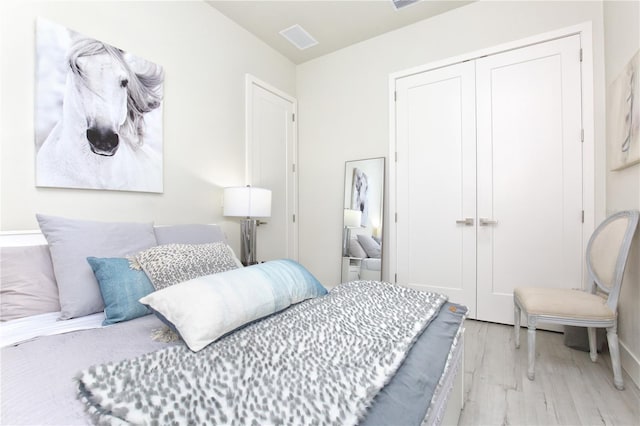 bedroom with a closet and light wood-type flooring