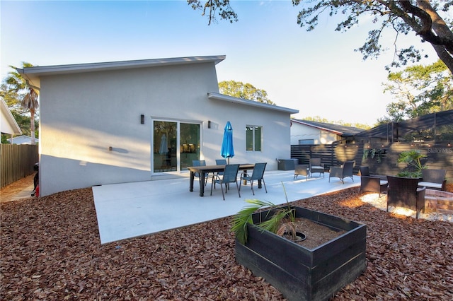 rear view of property with a patio area